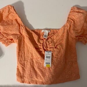 orange tilly’s crop top!